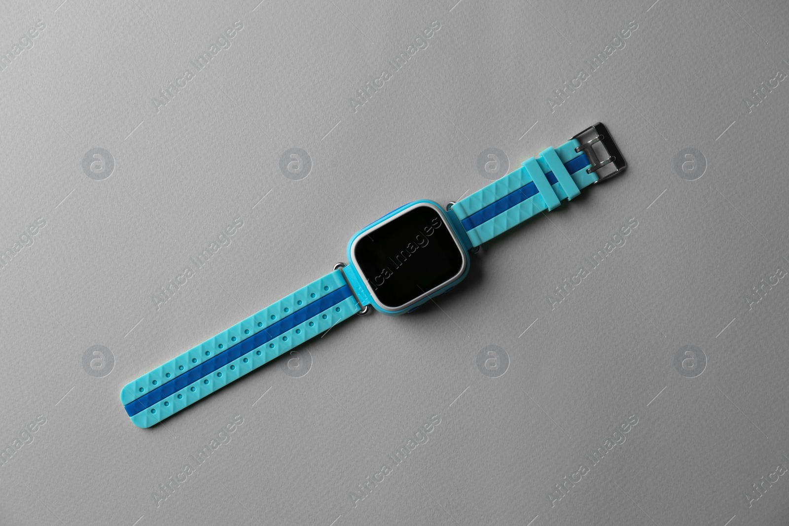 Photo of Trendy smart watch for kids on grey background, top view