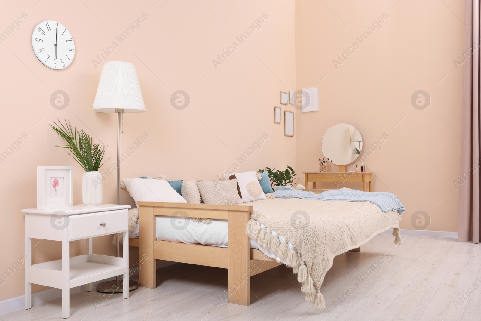 Photo of Cozy room interior with comfortable sofa bed. Multifunctional furniture