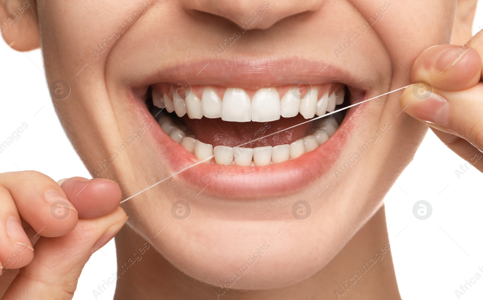 Photo of Woman flossing his teeth on white background, closeup. Dental care