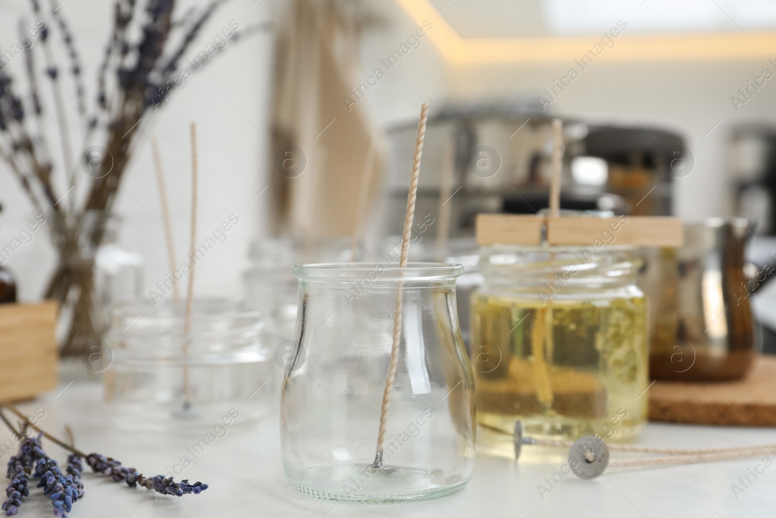 Photo of Empty glass jar on white table. Handmade candle