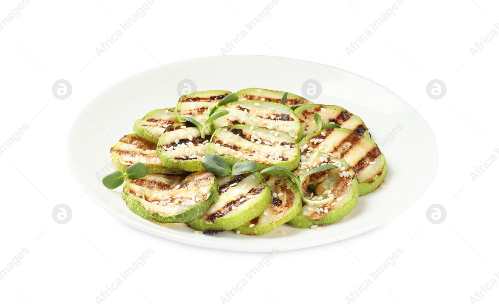 Photo of Delicious grilled zucchini slices and sesame on white background