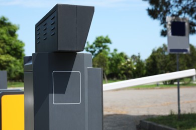 Modern parking meter outdoors on sunny day, closeup. Space for text
