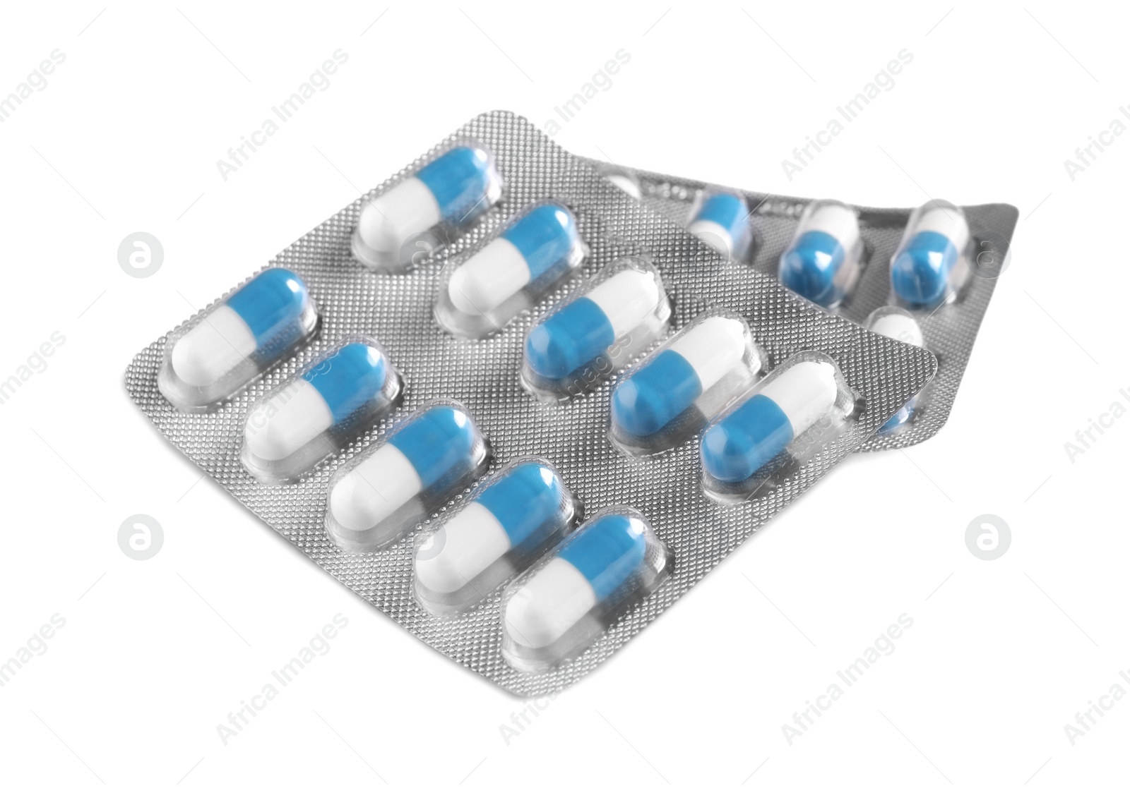 Photo of Blisters of pills on white background. Medicinal treatment