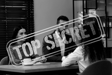 Image of Classified information. Stamp Top Secret on black and white photo of people in office