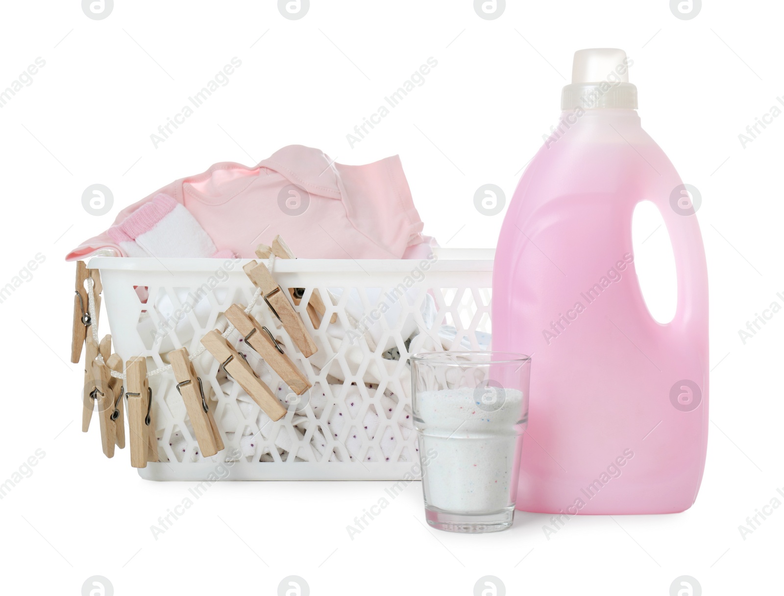 Photo of Detergent and children's clothes on white background