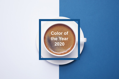Cup of coffee on bright background, top view. Color of the year 2020 (Classic blue)