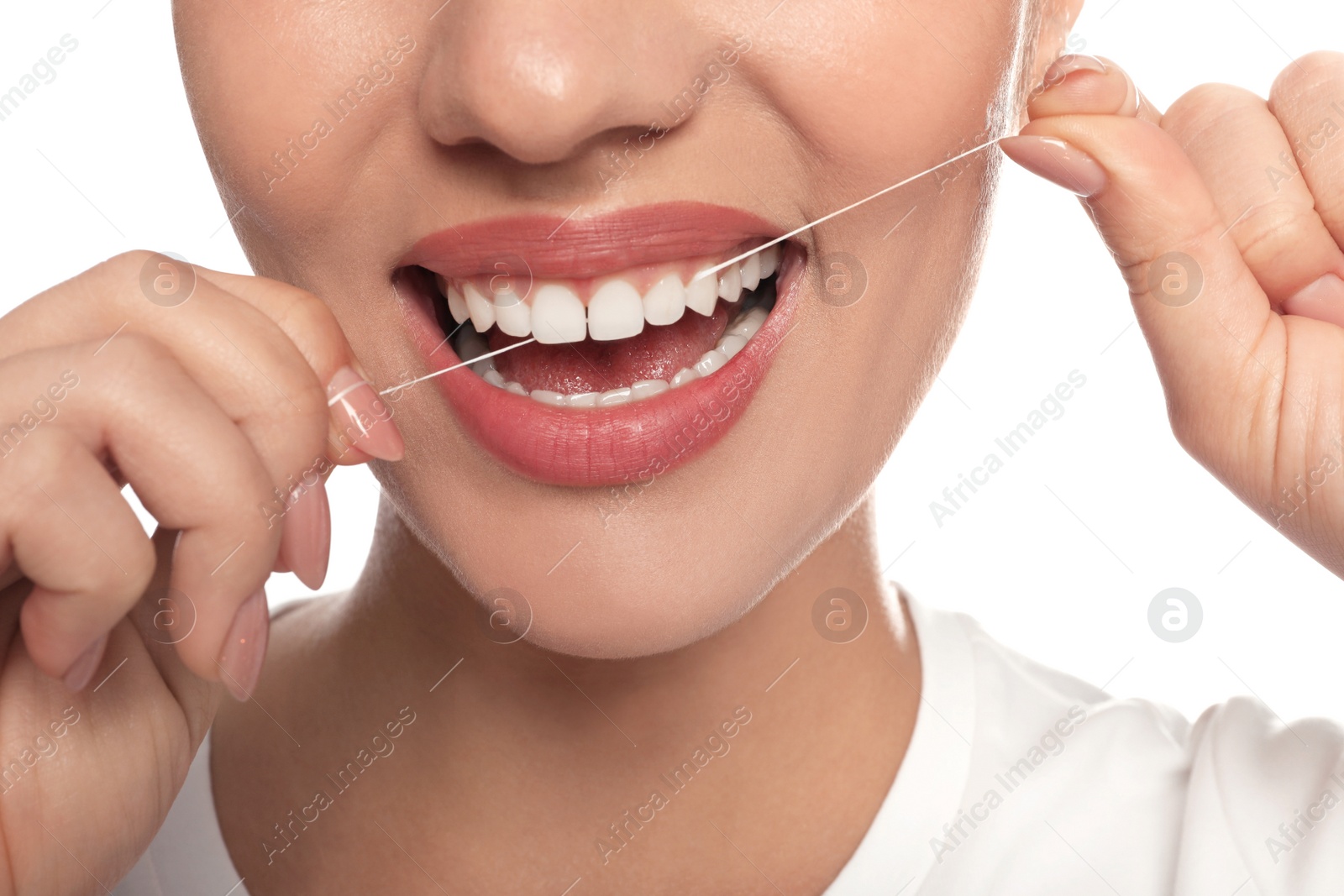 Photo of Woman flossing his teeth on white background, closeup. Dental care