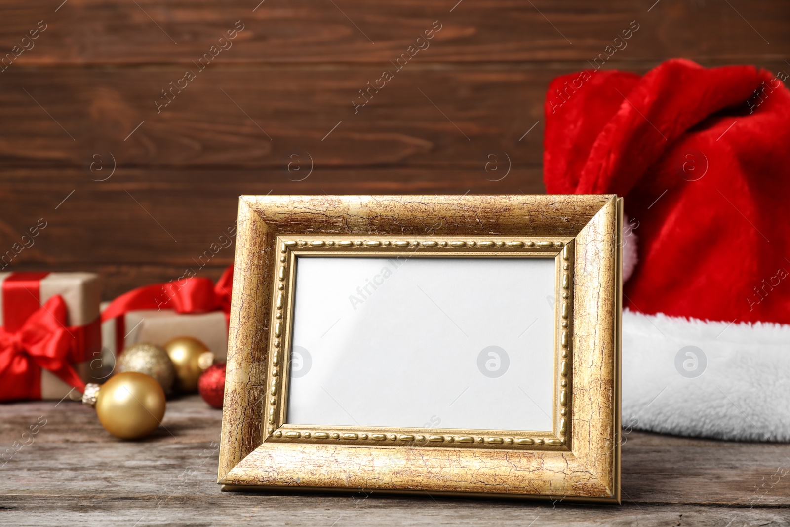 Photo of Empty frame and decor on table. Christmas countdown