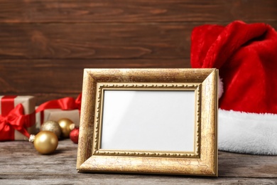 Photo of Empty frame and decor on table. Christmas countdown