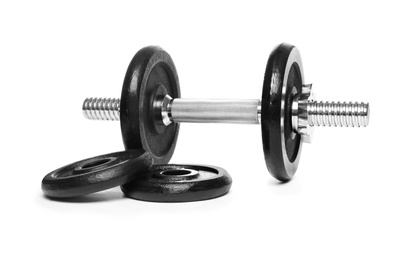 Photo of Professional dumbbell and weight plates on white background. Sporting equipment