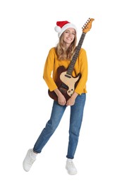 Photo of Young woman in Santa hat with electric guitar on white background. Christmas music