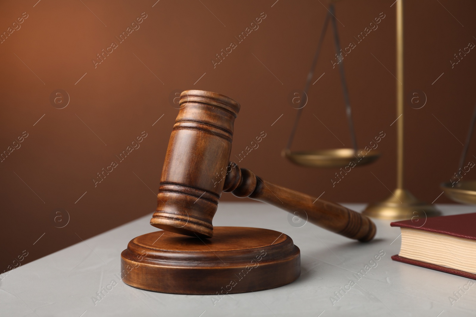Photo of Wooden gavel on grey table. Law concept