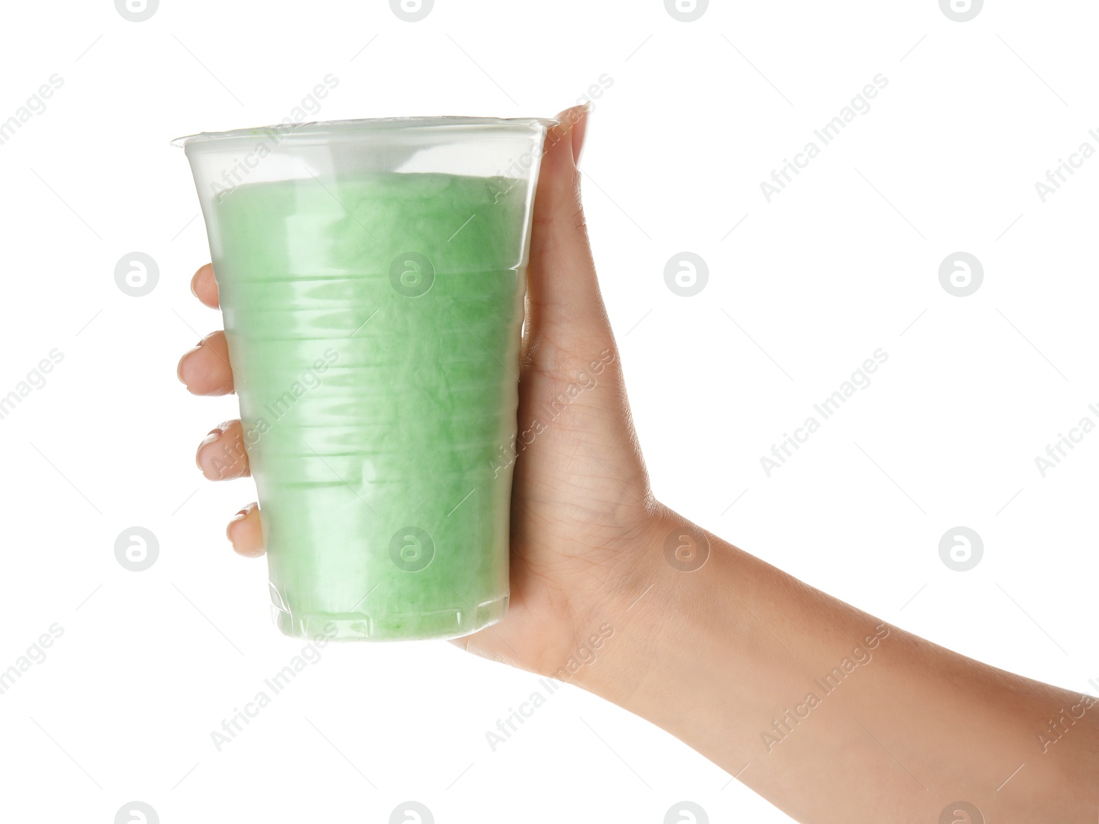 Photo of Woman holding plastic cup with yummy cotton candy on white background, closeup