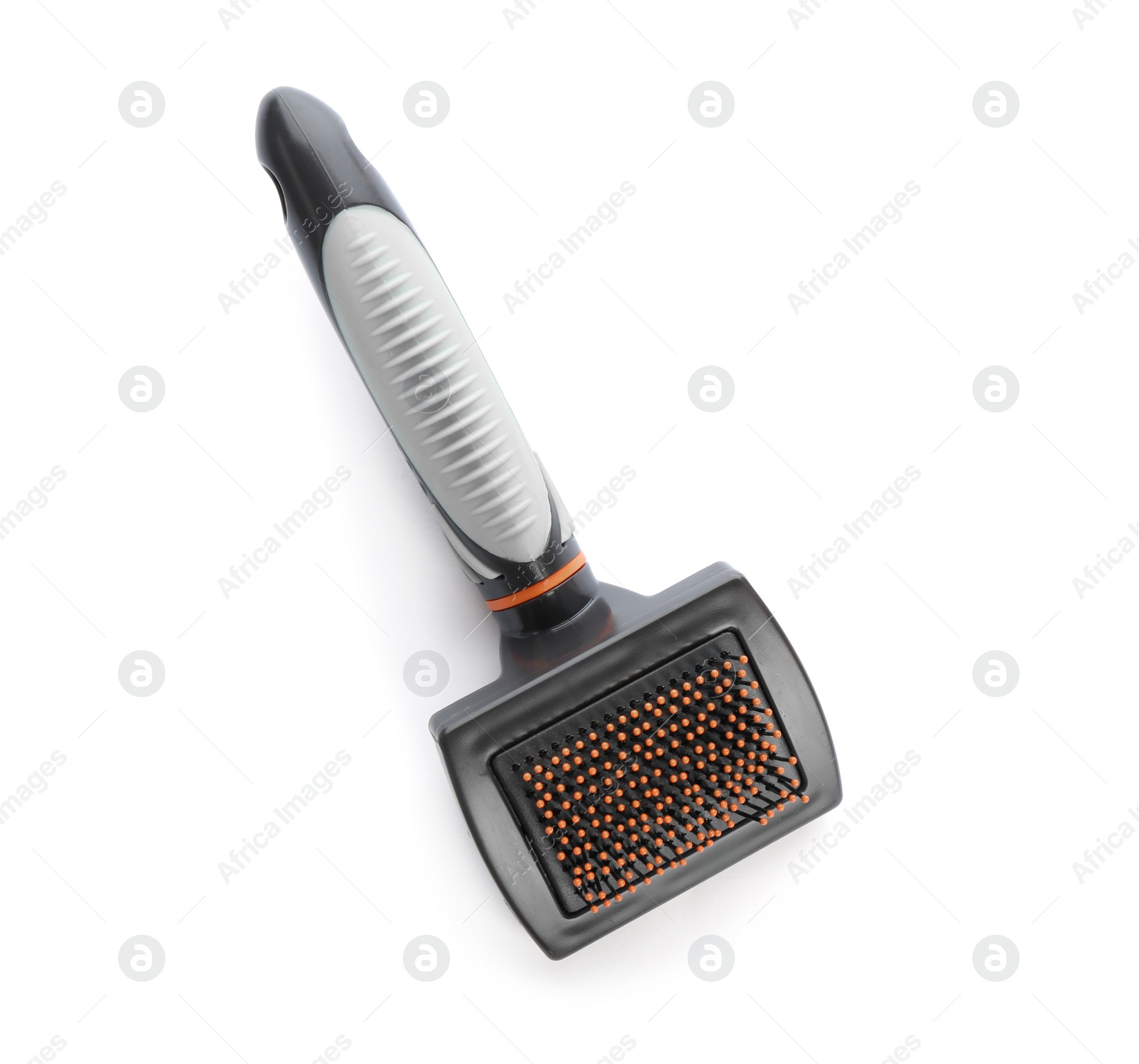 Photo of Brush for cat on white background, top view. Pet care