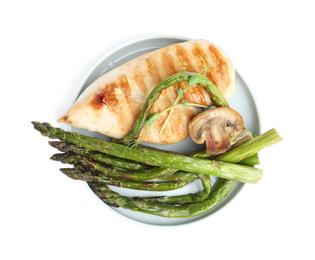 Photo of Tasty grilled chicken fillet with asparagus and mushroom isolated on white, top view