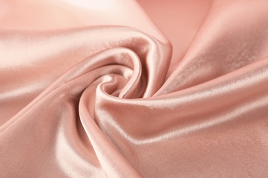 Texture of rose gold silk as background, closeup