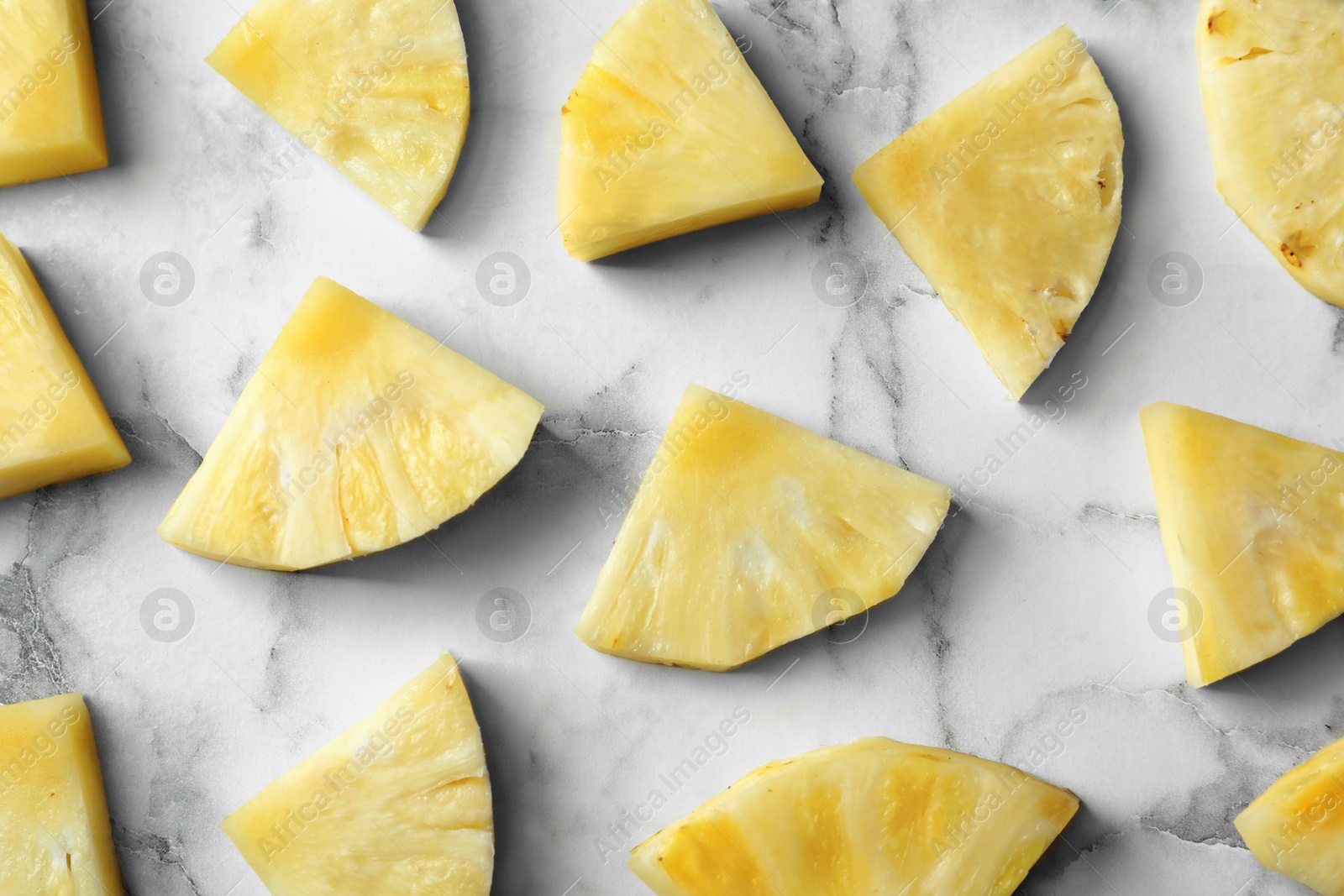 Photo of Flat lay composition with fresh sliced pineapple on marble background