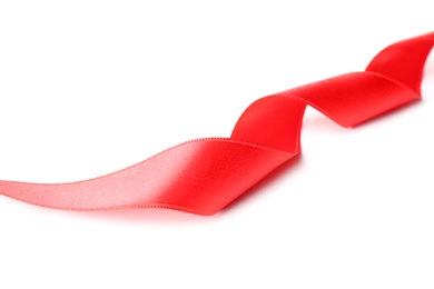 Photo of Simple red ribbon on white background. Festive decoration