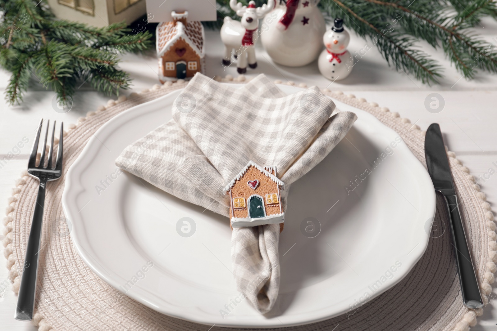 Photo of Luxury place setting with beautiful festive decor for Christmas dinner on white table, closeup