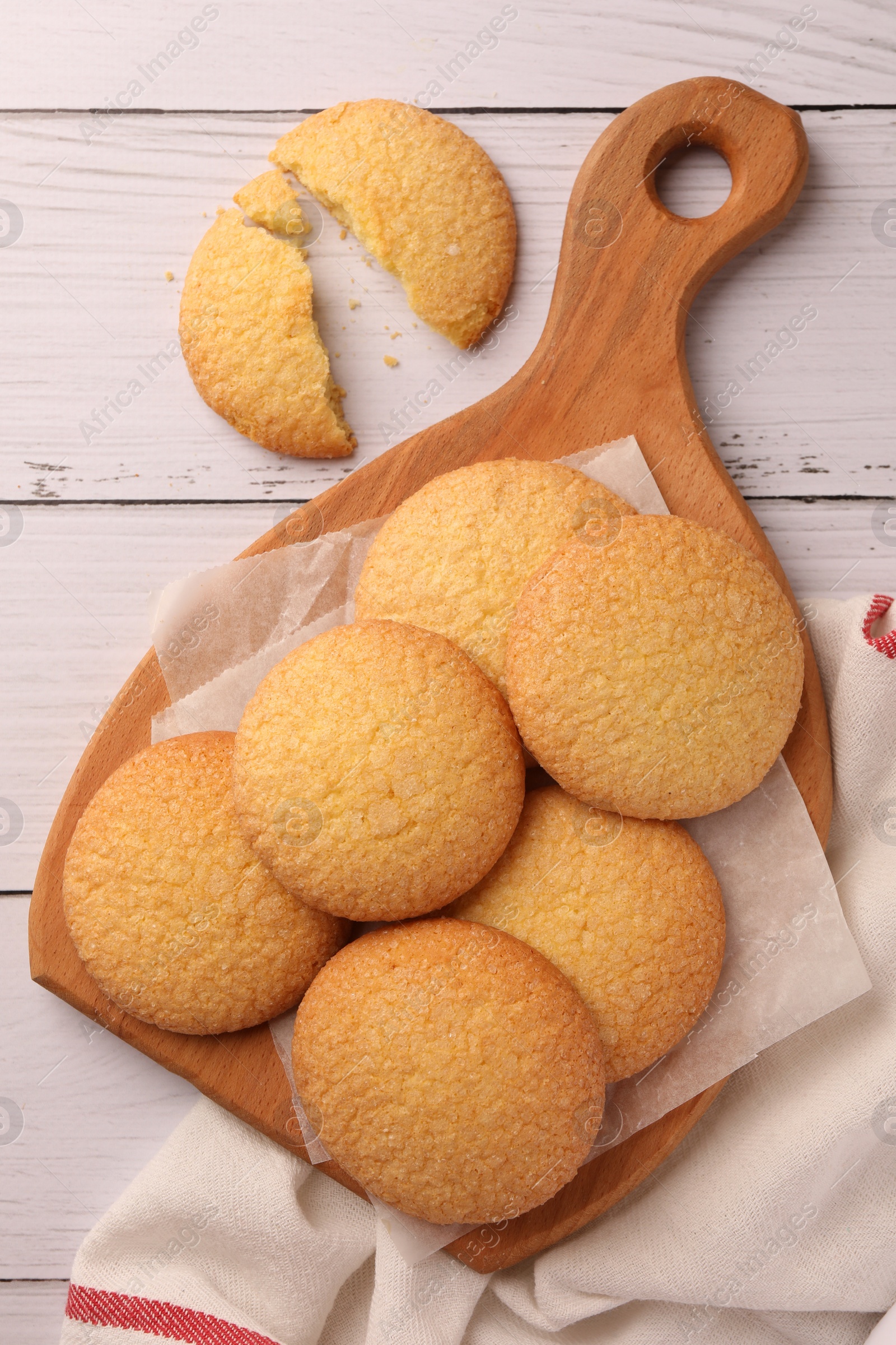 Photo of Delicious Danish butter cookies on white wooden table, flat lay