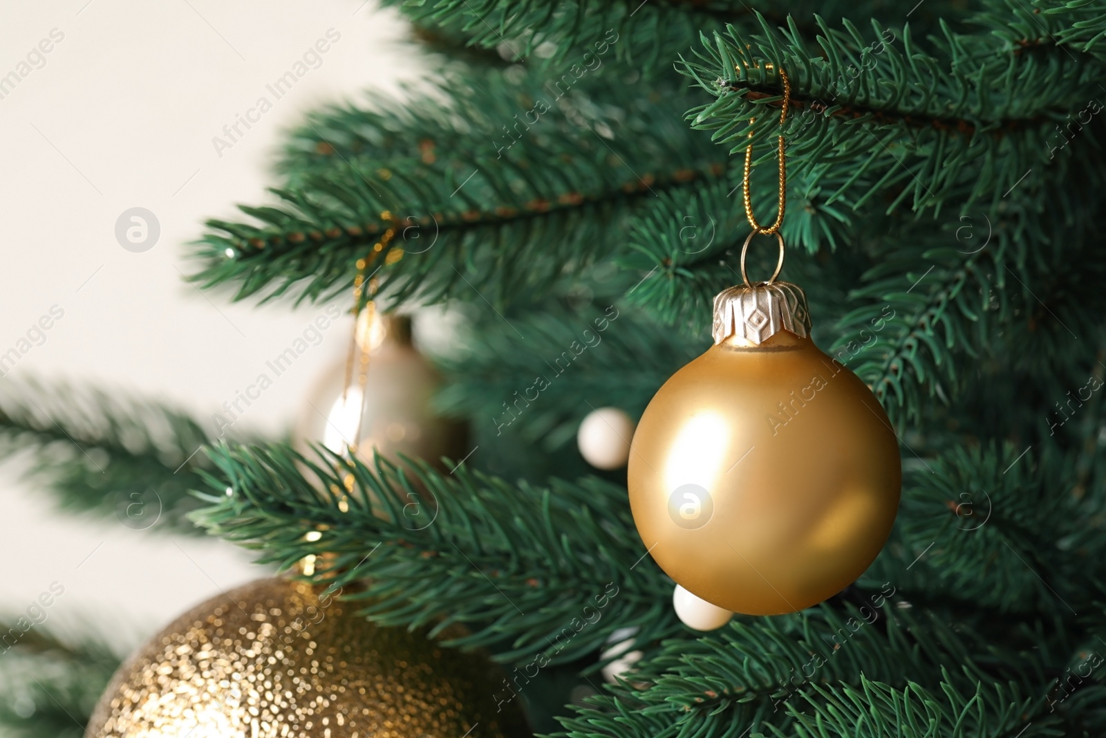 Photo of Beautiful Christmas tree with festive decor on white background, closeup