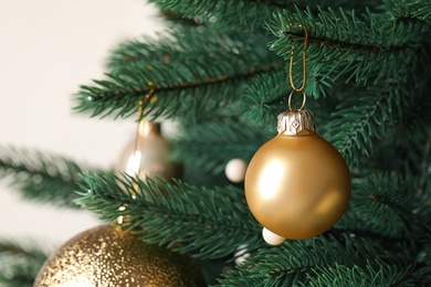 Photo of Beautiful Christmas tree with festive decor on white background, closeup