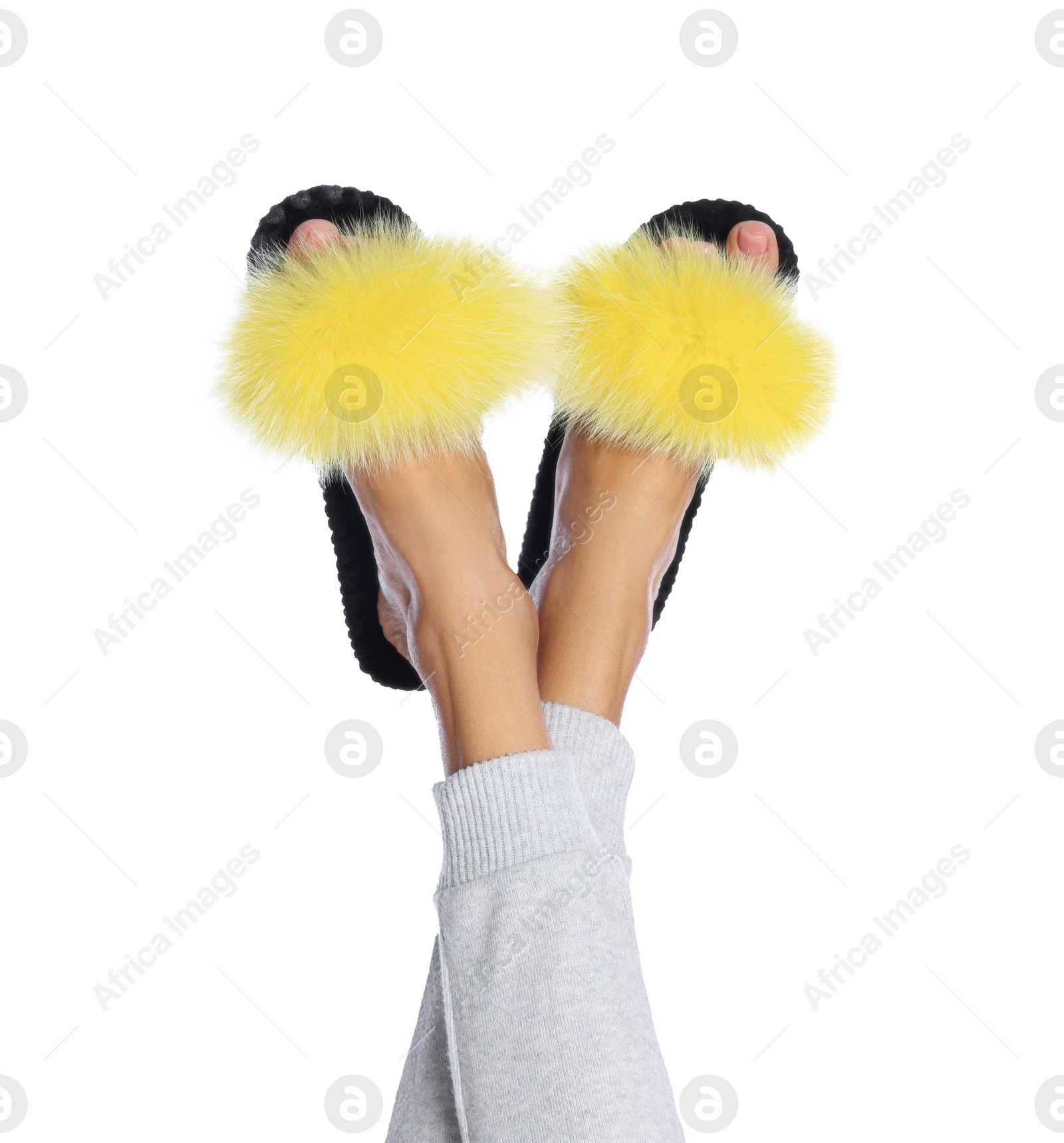 Photo of Woman in fluffy slippers on white background, closeup