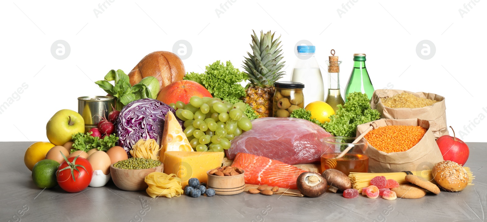 Photo of Different products on grey table. Healthy food and balanced diet