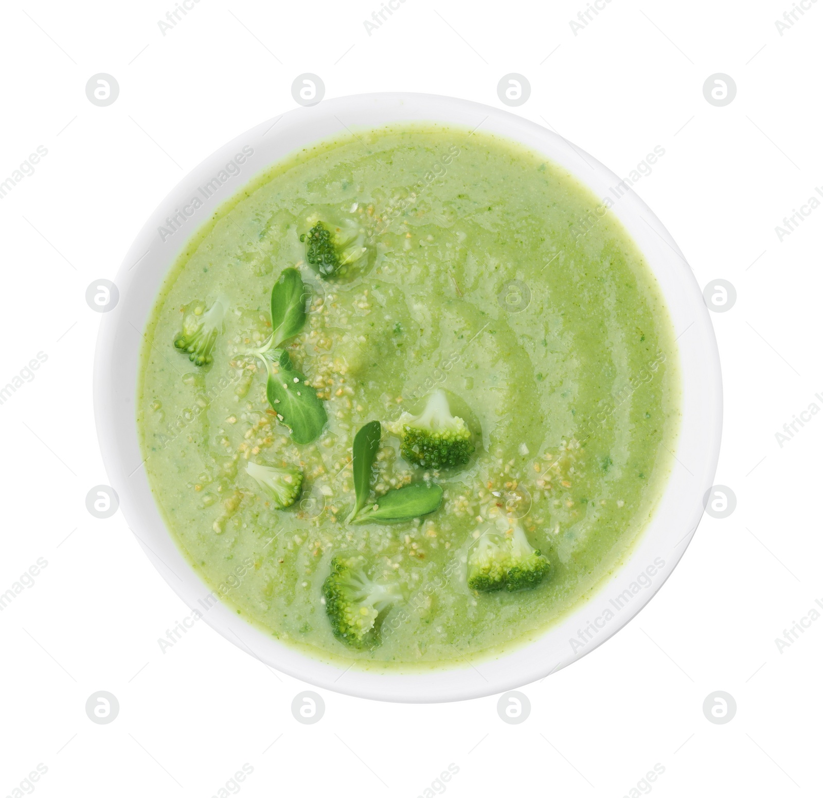 Photo of Delicious broccoli cream soup isolated on white, top view