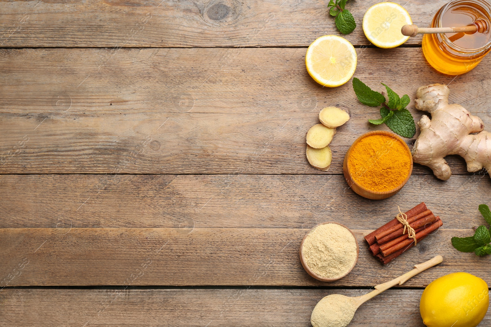 Photo of Flat lay composition with fresh products on wooden table, space for text. Natural antibiotics