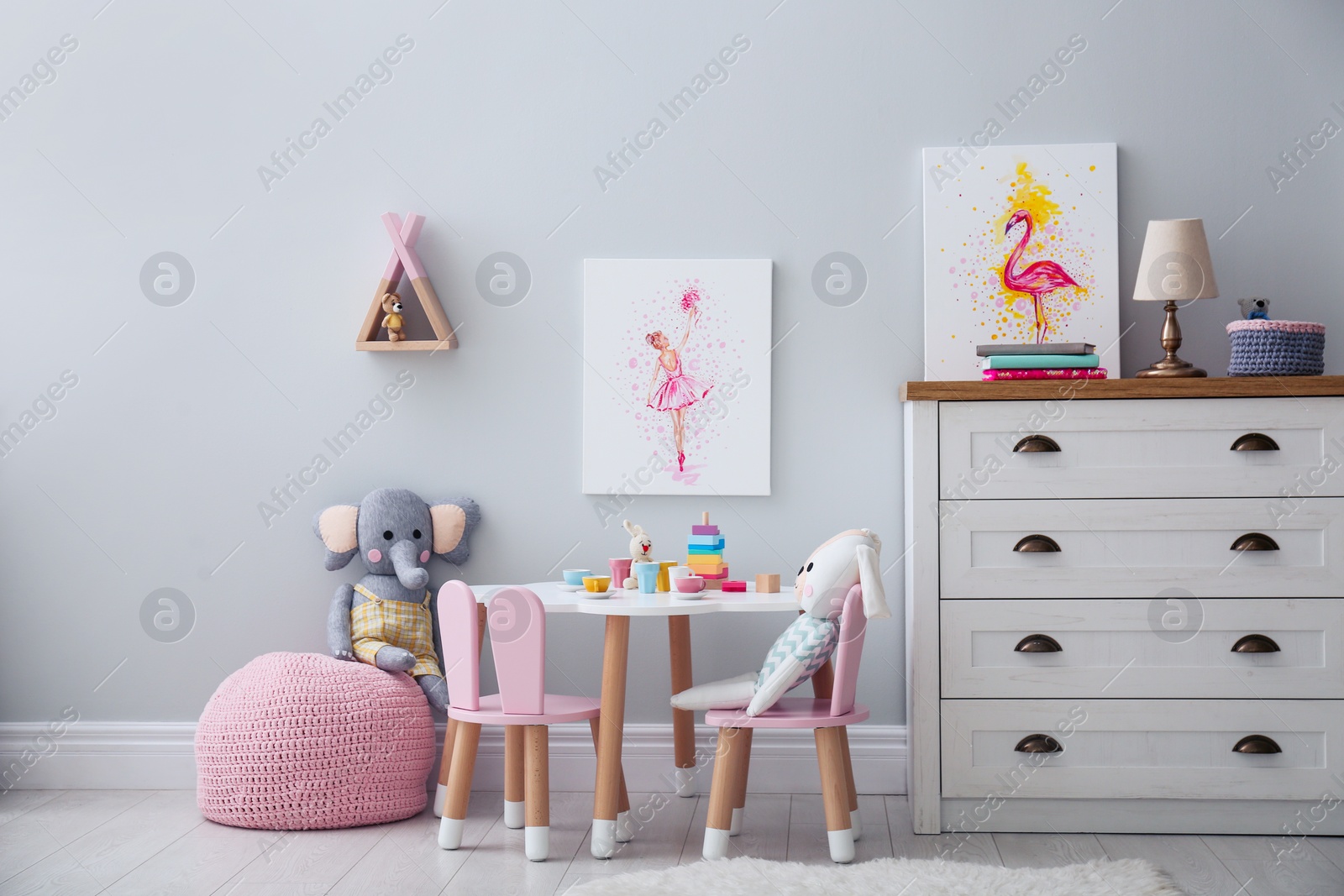 Photo of Children's room with modern furniture and pictures. Interior design