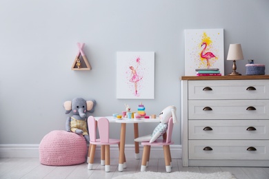 Children's room with modern furniture and pictures. Interior design
