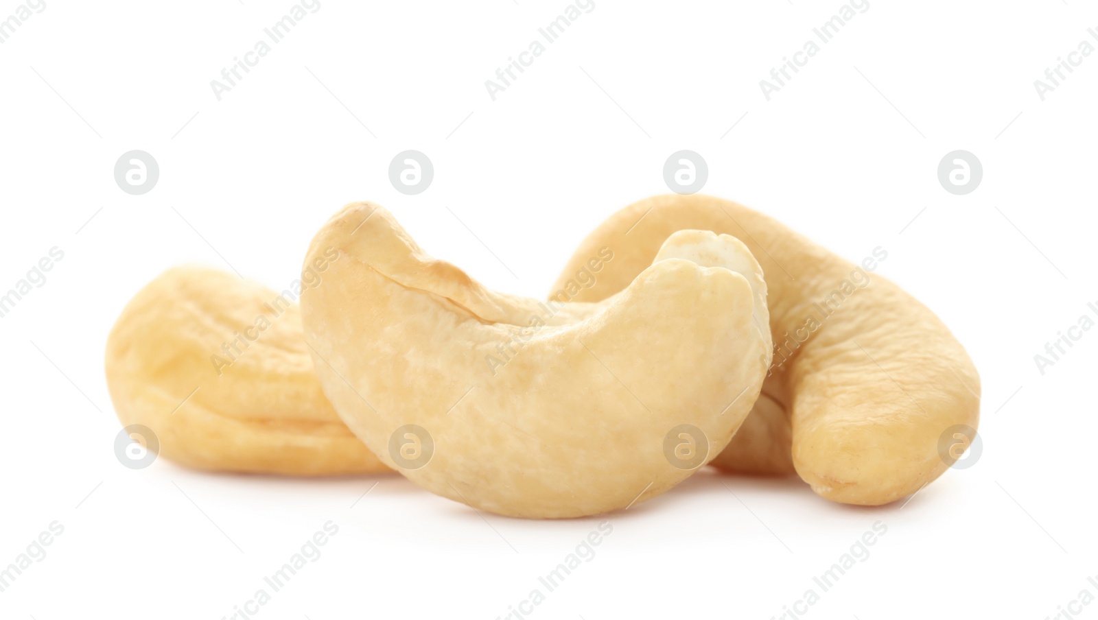 Photo of Pile of tasty organic cashew nuts isolated on white