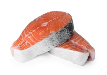 Fresh raw salmon steaks on white background