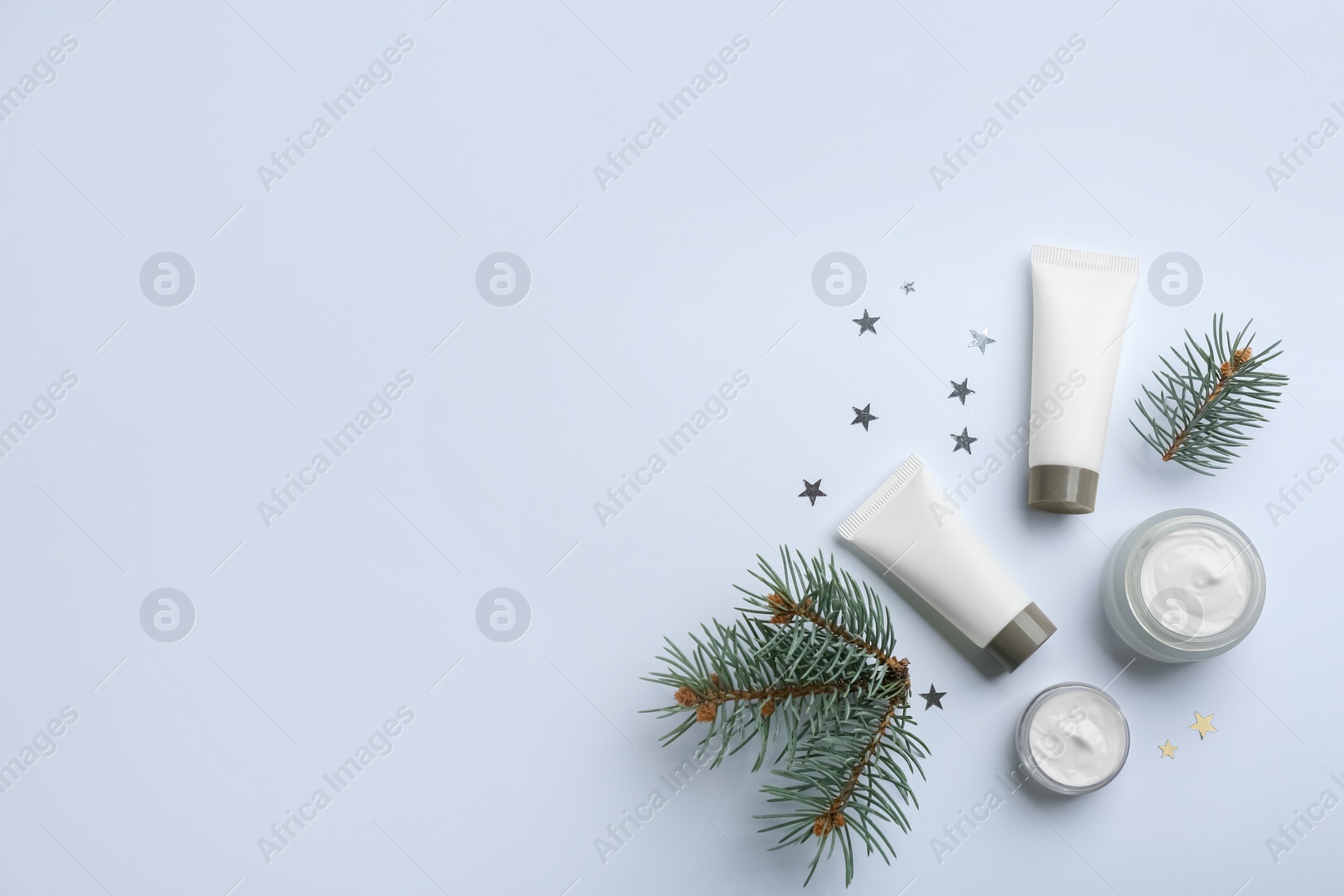 Photo of Set of different cosmetic products on white background, flat lay. Winter care