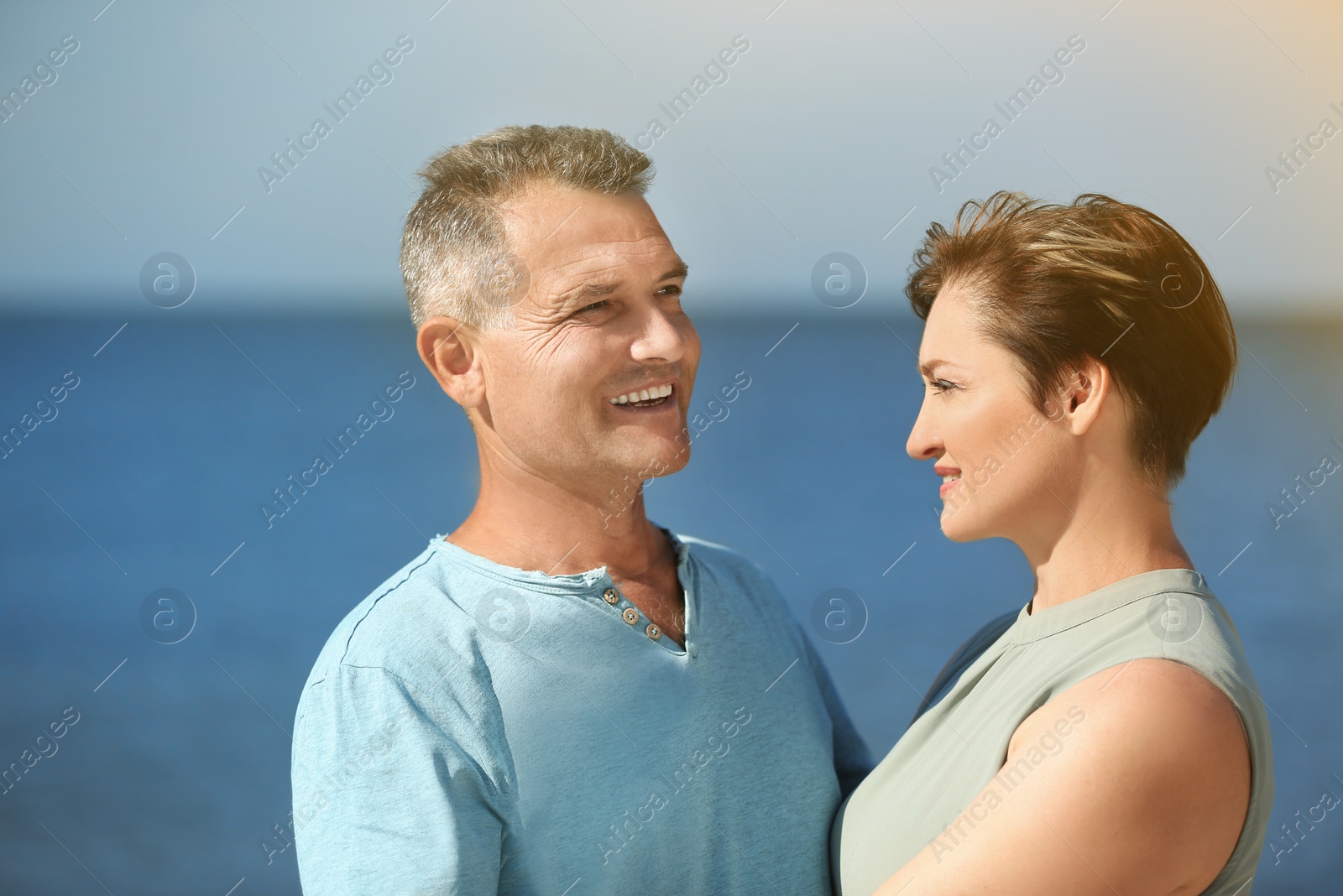 Photo of Happy mature couple at beach on sunny day