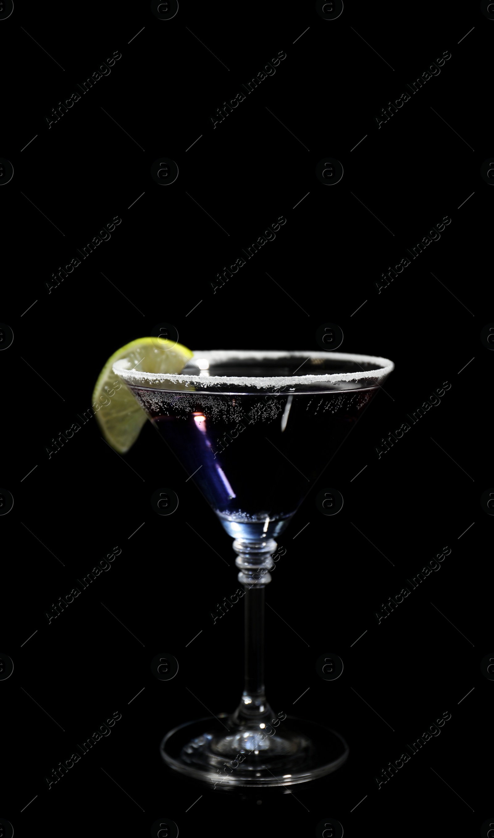 Photo of Glass of delicious cocktail on black background