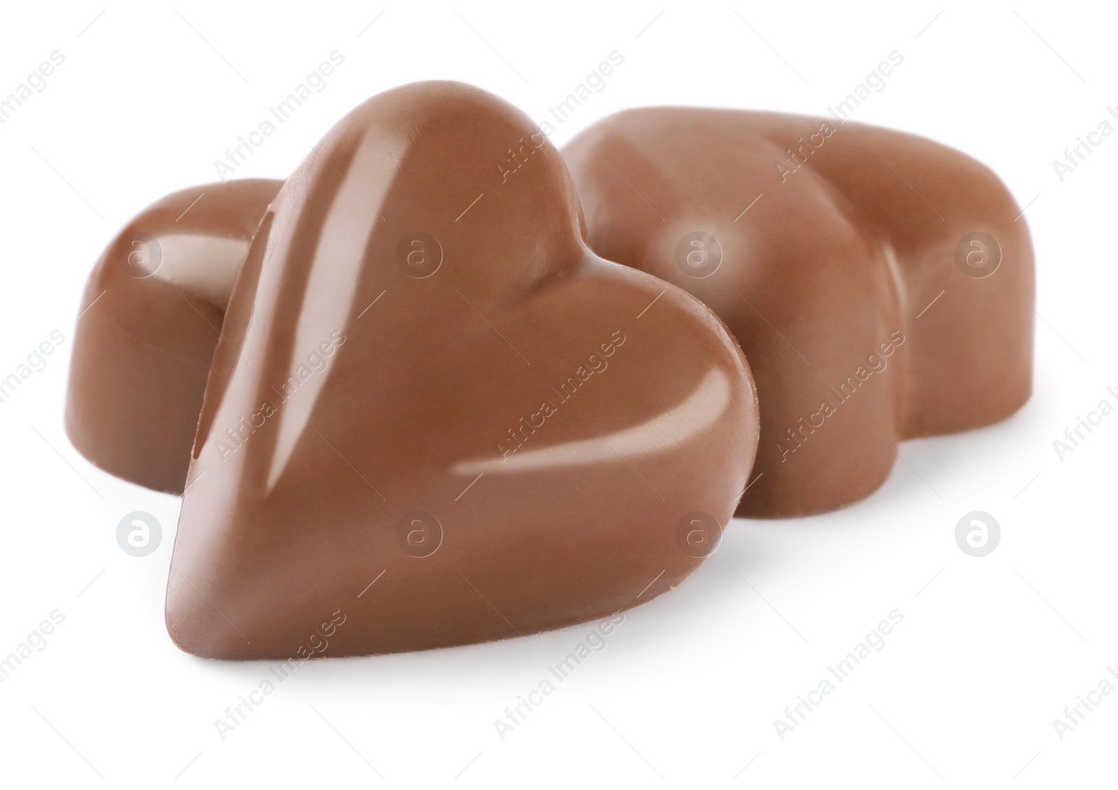 Photo of Beautiful heart shaped chocolate candies on white background