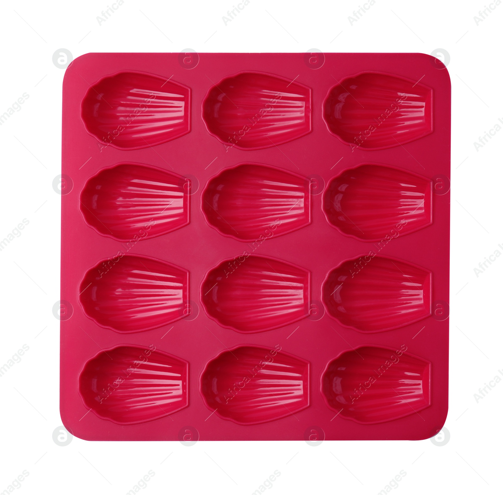 Photo of Red baking mold for madeleine cookies on white table, top view