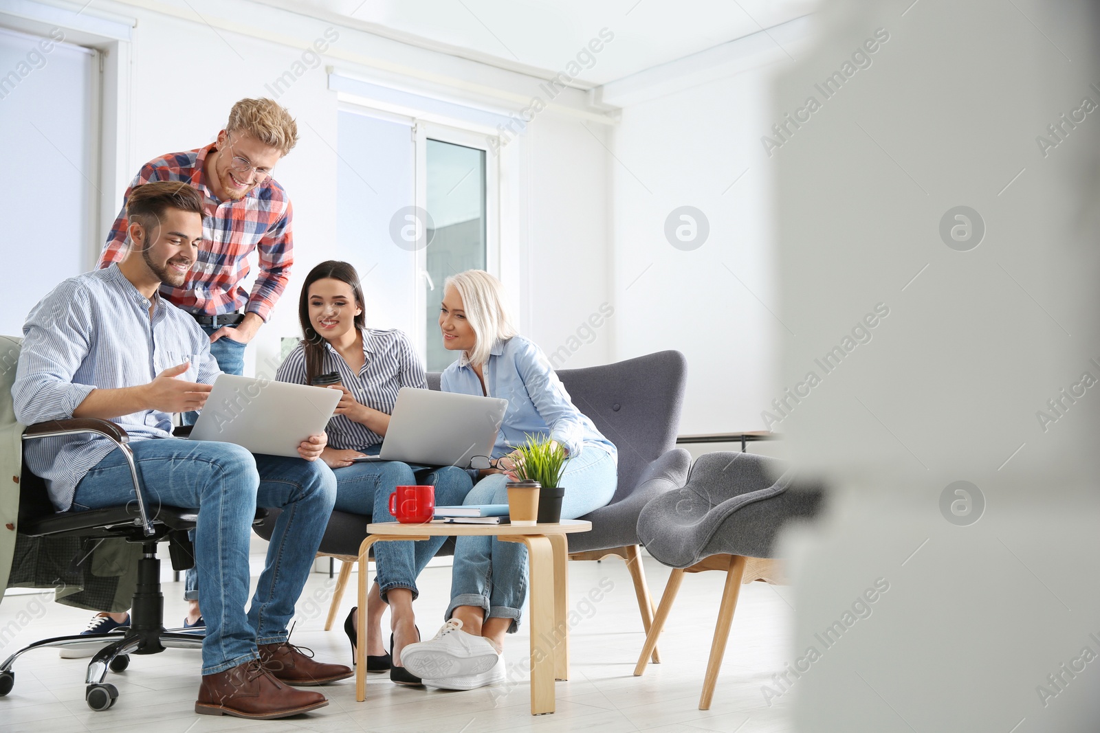 Photo of Business people discussing work matters in office, space for text. Professional communication