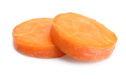 Slices of fresh ripe carrot on white background