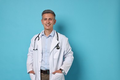 Photo of Doctor with stethoscope on light blue background, space for text