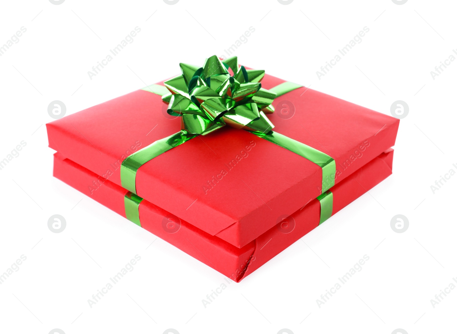 Photo of Christmas gift box decorated with ribbon bow on white background