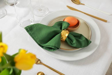 Festive Easter table setting with painted egg