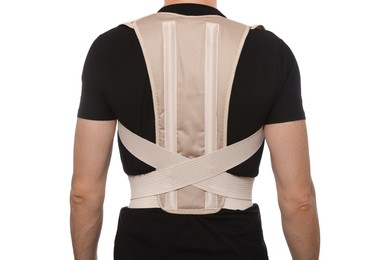 Photo of Closeup of man with orthopedic corset on white background, back view