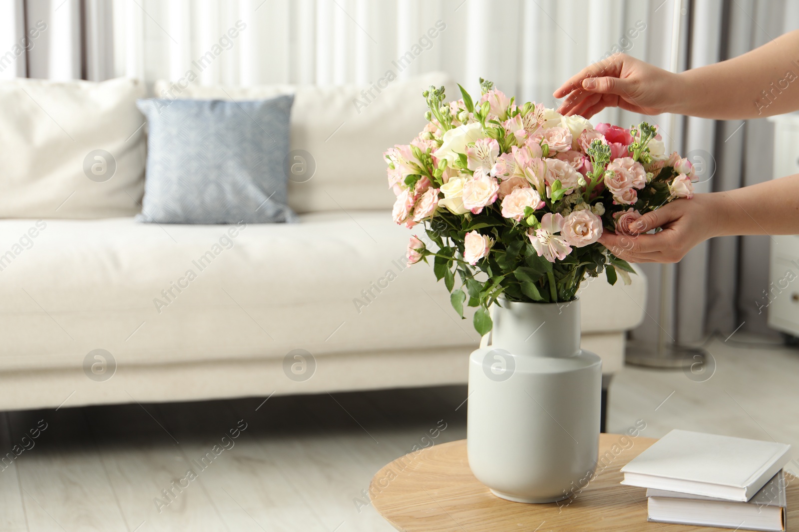 Photo of Woman with beautiful bouquet of fresh flowers at home, closeup. Space for text