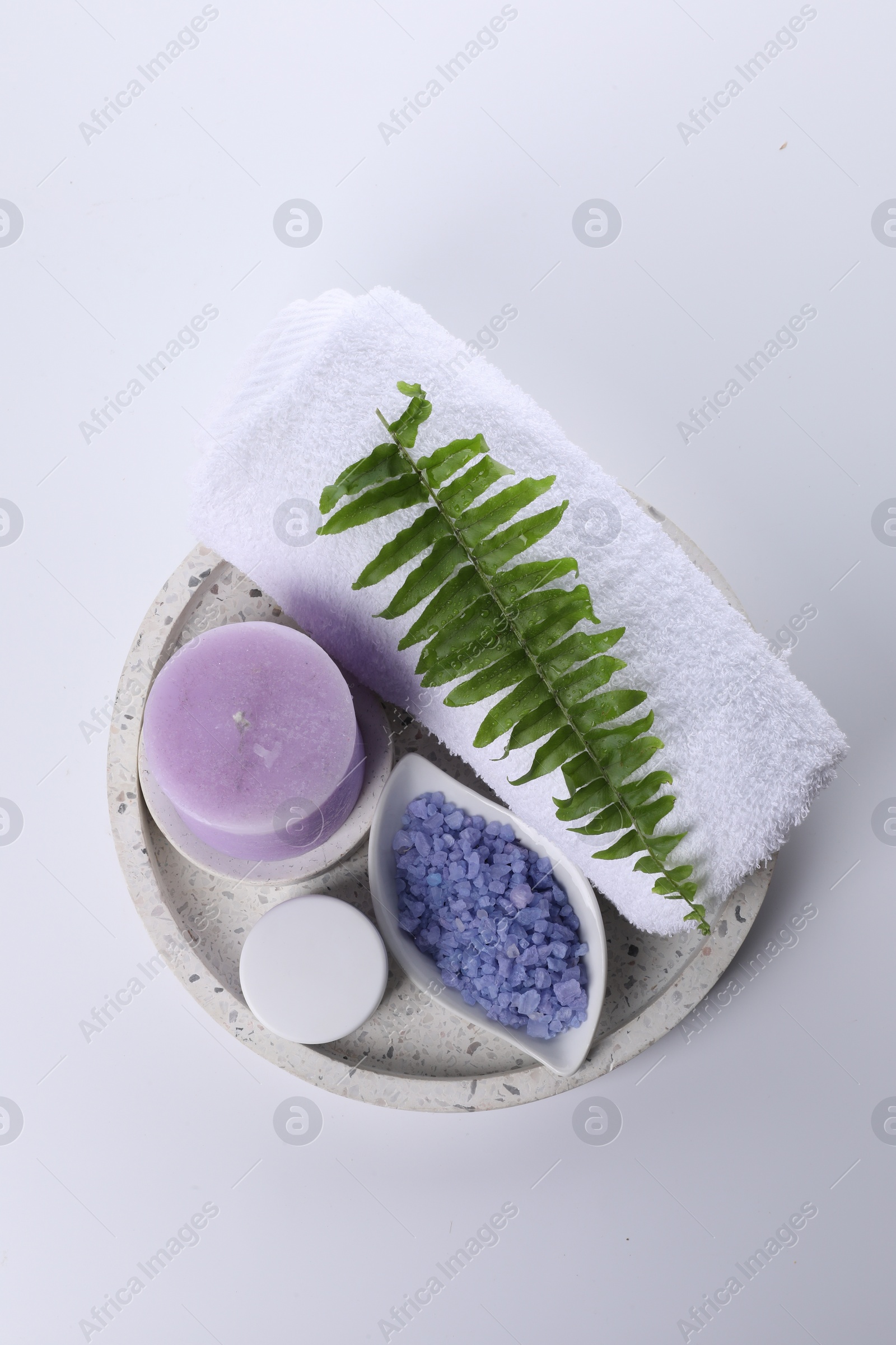 Photo of Composition with spa products and candle isolated on white, top view