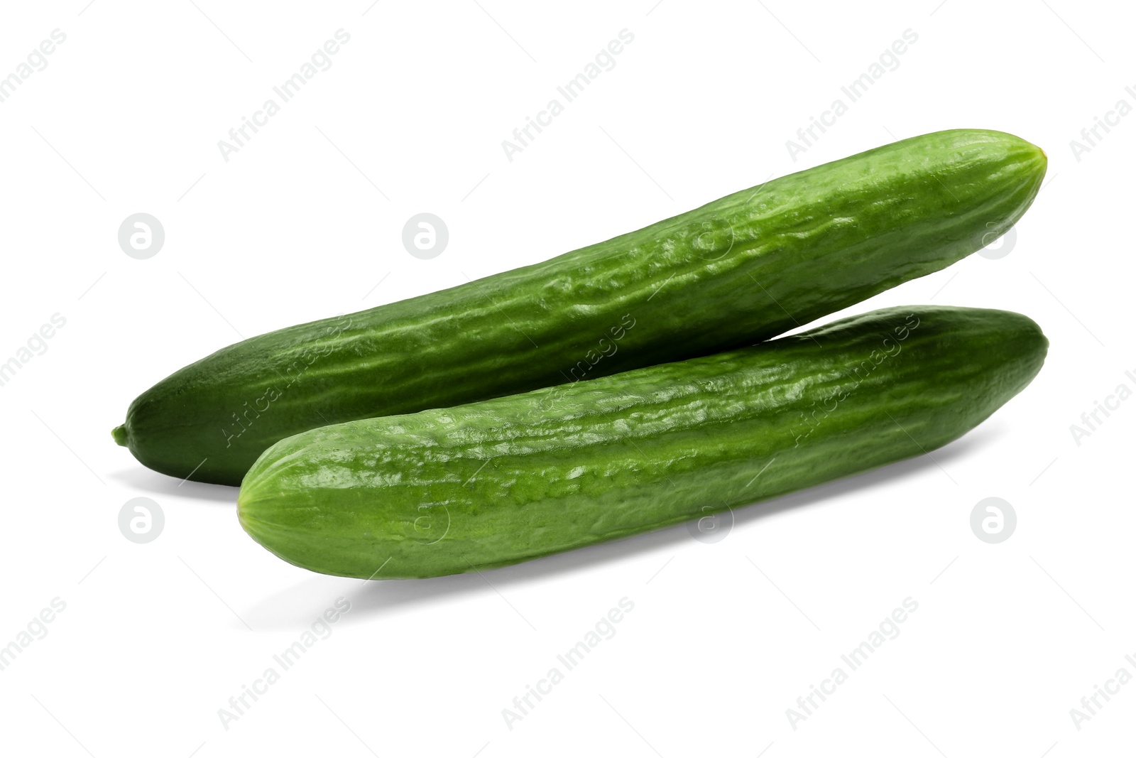 Photo of Two long fresh cucumbers isolated on white