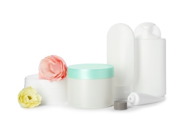 Photo of Jars with cream and bottles on white background. Hand care cosmetics