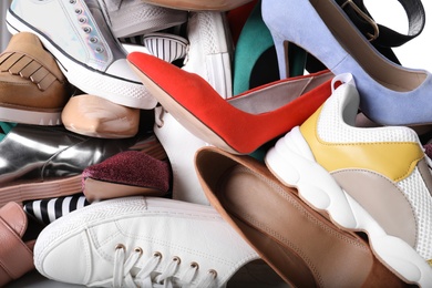 Photo of Different colorful female shoes as background, closeup